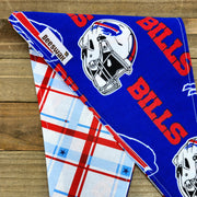 A blue bandana with a football helmet and the word "BILLS" printed on it, along with a plaid pattern.